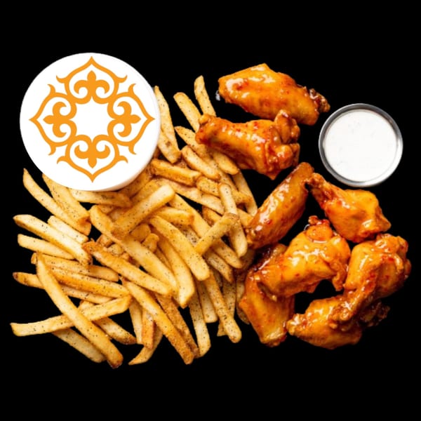 BÖRO KABOB's crispy french fries, spicy chicken wings, and a side of ranch dressing.