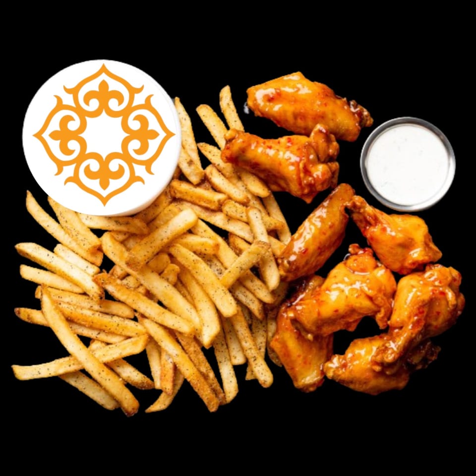 BÖRO KABOB's crispy french fries, spicy chicken wings, and a side of ranch dressing.